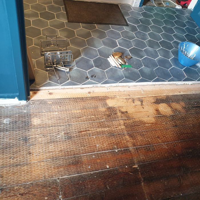 Ramps & the like to join thick tiles to floorboards