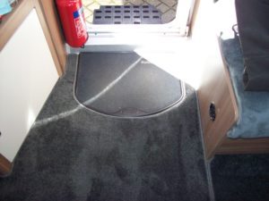 Grey caravan made-to-size carpets edged in Grey Duster carpet trim