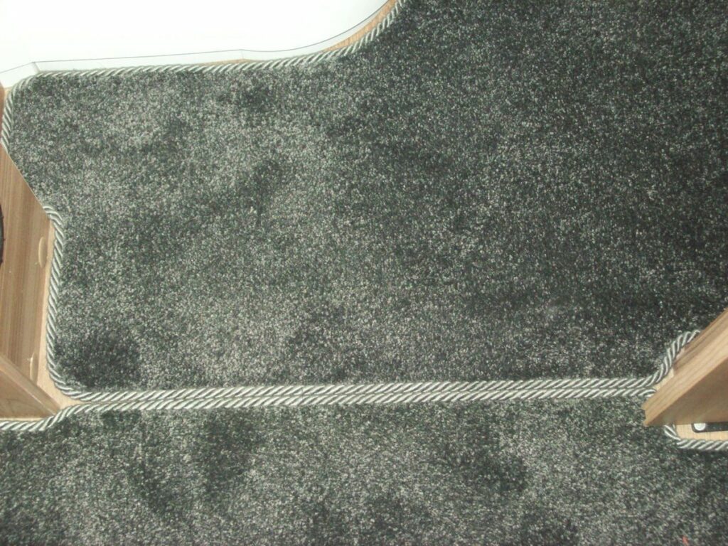 grey-carpet-trimmed-with-Grey-Duster-Easybind-fitted-in-caravan