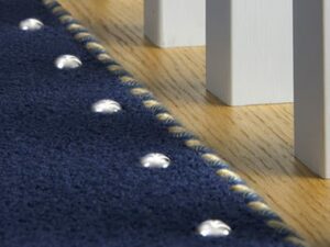 door-thresholds-carpetstuds on blue landing carpet