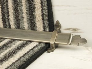 Beaumont design of stair rod with decorative ends, pewter, fitted to stair runner
