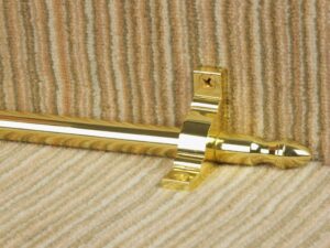 Homepride front fix stair rod, polished brass, fitted over cream striped stair carpet