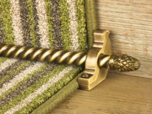 sherwood carpet rod with fir cone finial, bracket in antique brass