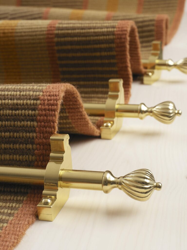 Cairo stair rod in polished brass on flatweave stair runner