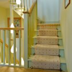 Stair rods buying guide featuring Chatsworth brass stair rods on beige runner 