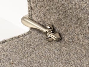 Victorian Stair Clip in polished nickel attached to step riser