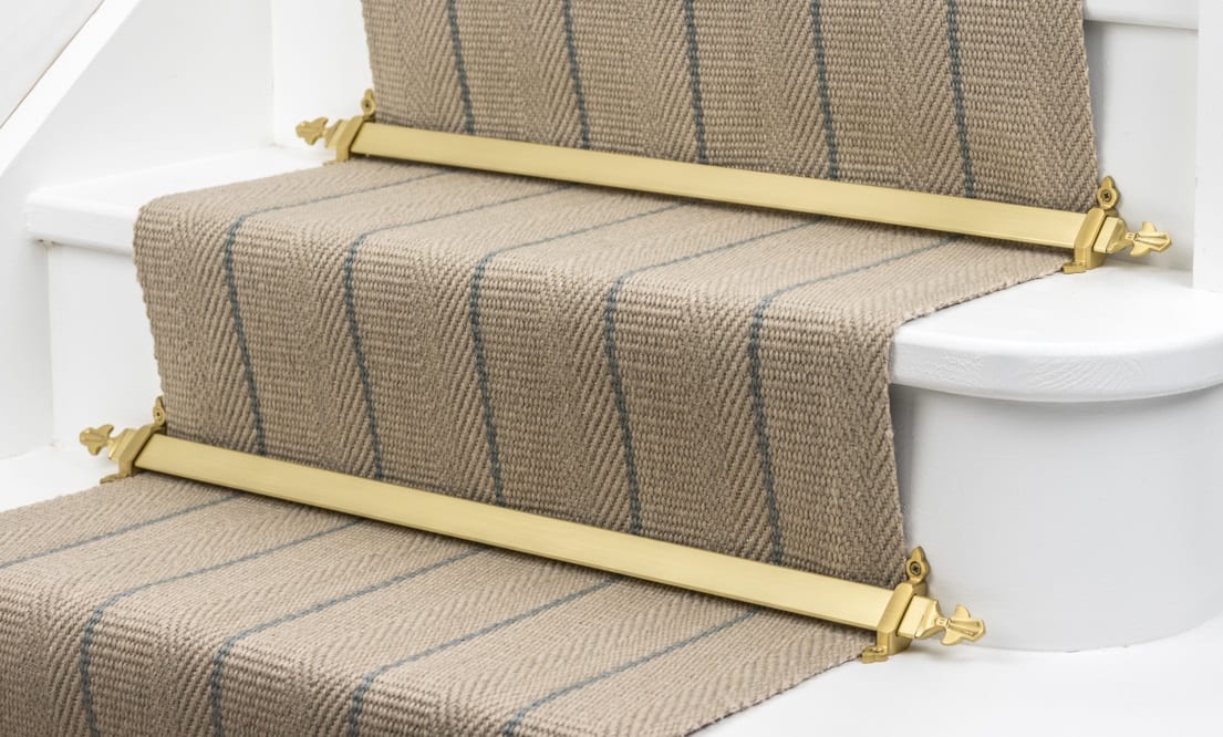 Louis stair rods in polished brass on striped, natural runner