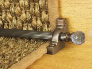 Crystal sky stair rod in antique brass on natural runner