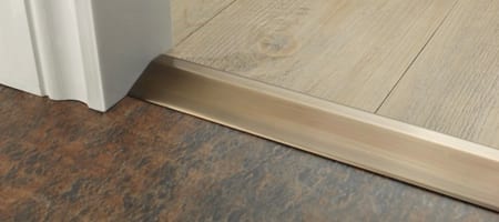 Premier Ramp door bar joins lower LVT flooring to higher level wood flooring