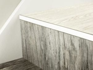 LVT Nosing No Bull fitted on vinyl covered step in polished nickel