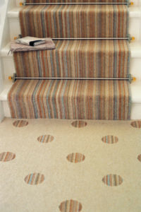 Amber Crystal stair rods fitted on striped runner stair carpet
