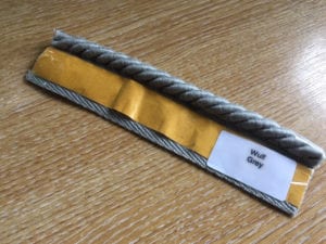 Easybind carpet edge tape in gret showing peel off strip