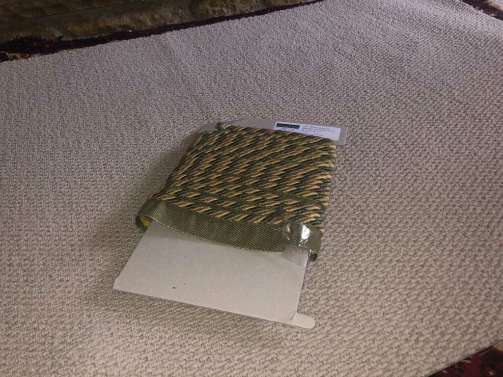 Green Easybind carpet binding tape wrapped around card