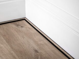 scotia laminate beading i black attached to skirting board